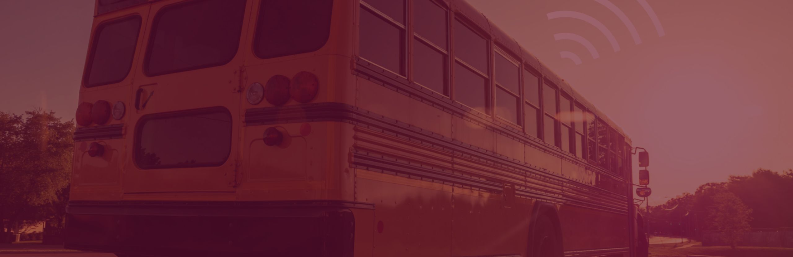 Image of school bus & wifi icon with a maroon overlay